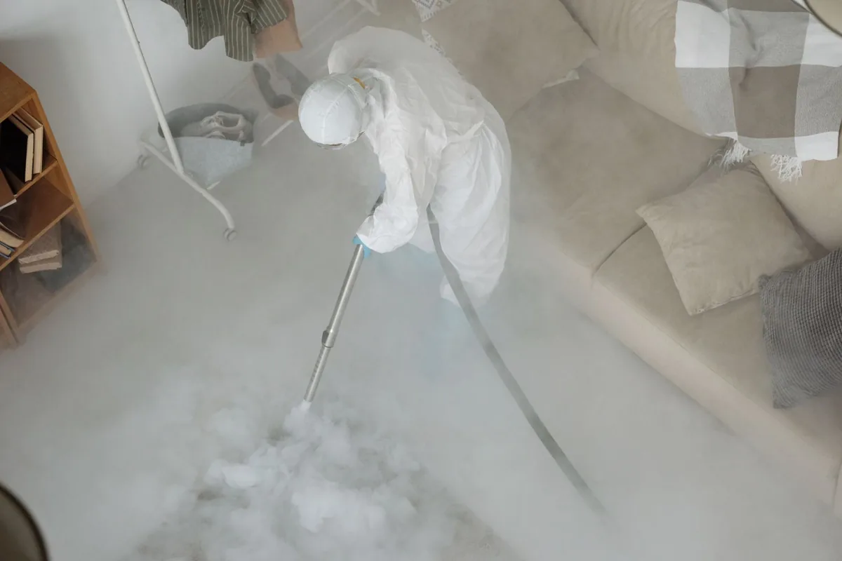 Biohazard cleanup technician in protective equipment, San Carlos Park, FL